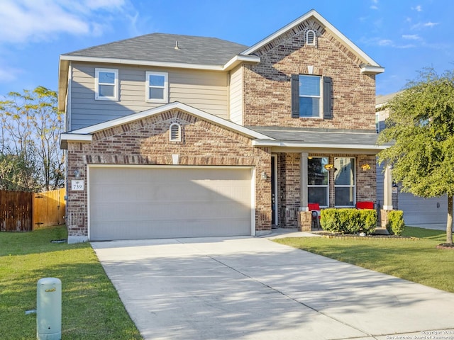 view of property featuring a front lawn and a garage