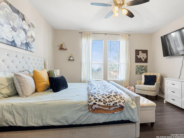 bedroom with ceiling fan and dark wood-type flooring