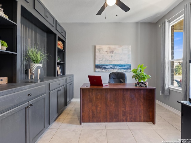 tiled office space with ceiling fan