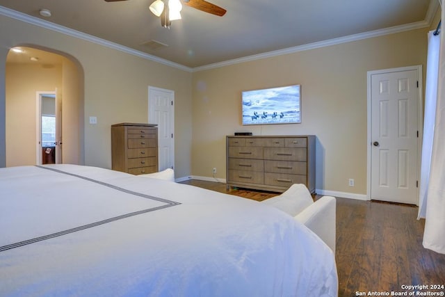 bedroom featuring ceiling fan, dark hardwood / wood-style flooring, and ornamental molding