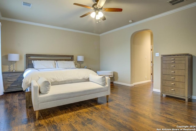 bedroom featuring ceiling fan, dark hardwood / wood-style flooring, and crown molding