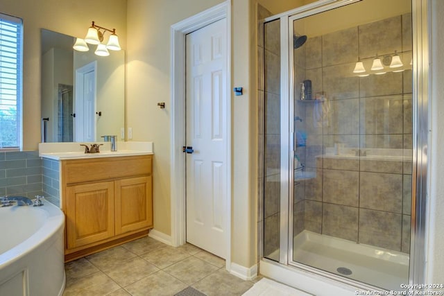 bathroom featuring vanity, tile patterned flooring, and plus walk in shower