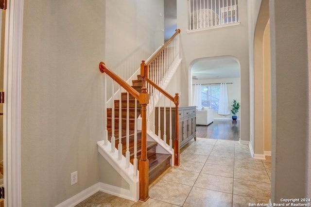 staircase with tile patterned floors