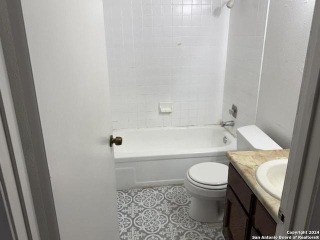 full bathroom featuring vanity, toilet, and tiled shower / bath combo