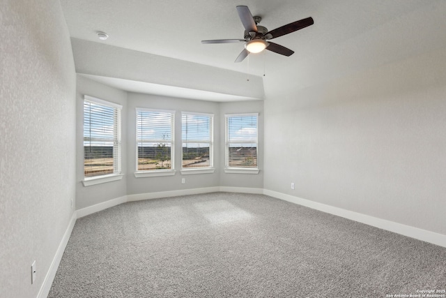 unfurnished room featuring carpet, a wealth of natural light, and ceiling fan