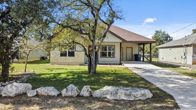 view of front facade with a front lawn and a carport