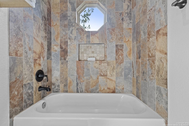 bathroom with a tub to relax in