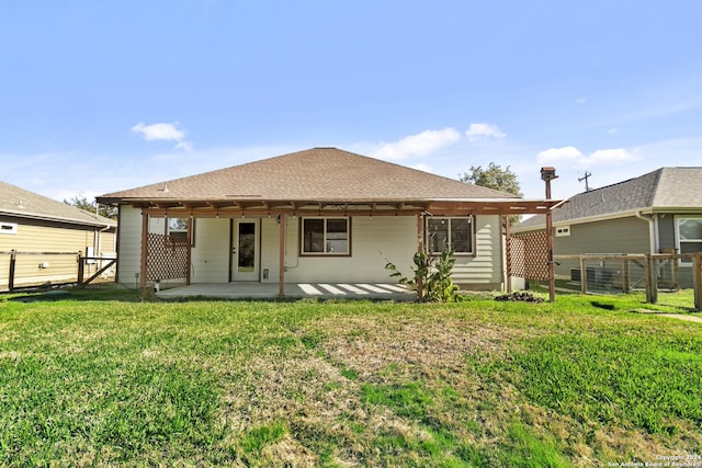 back of house featuring a yard and a patio