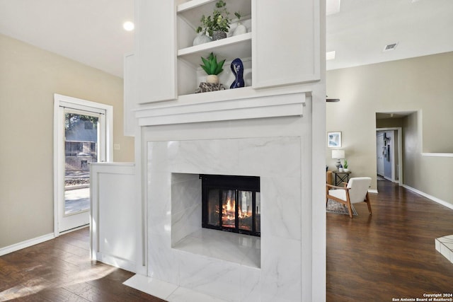 interior space featuring dark hardwood / wood-style floors and a fireplace