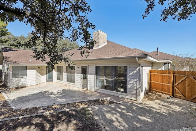 rear view of property with a patio area