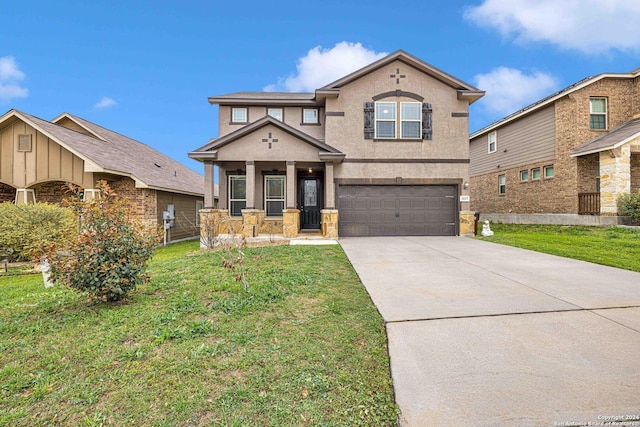 view of front of home with a front lawn and a garage