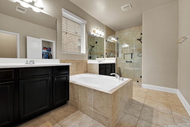 bathroom featuring tile patterned floors, vanity, and separate shower and tub