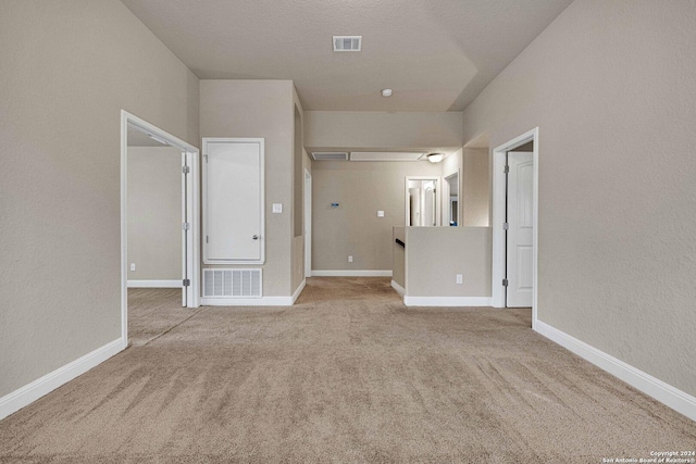 unfurnished room with carpet flooring