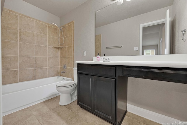 full bathroom with toilet, tile patterned flooring, vanity, and tiled shower / bath