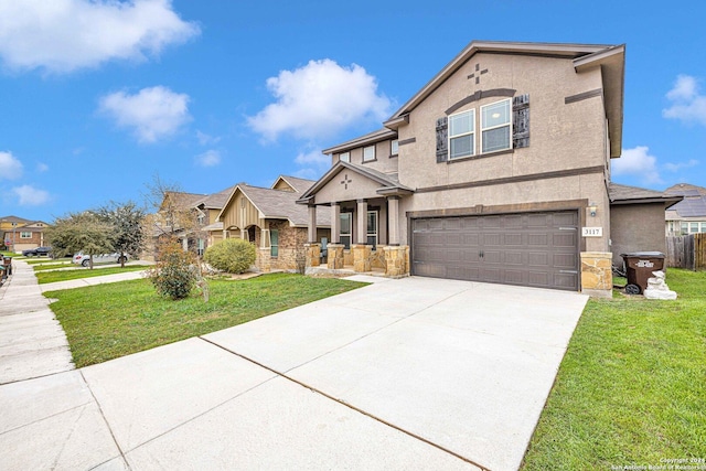 view of front of property with a front yard and a garage