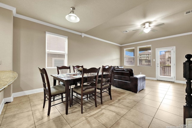 dining area with ceiling fan, light tile patterned flooring, and ornamental molding