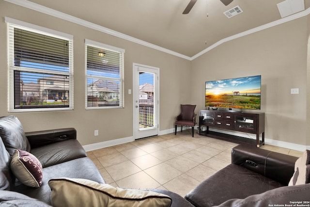 living room with ceiling fan, light tile patterned flooring, ornamental molding, and vaulted ceiling