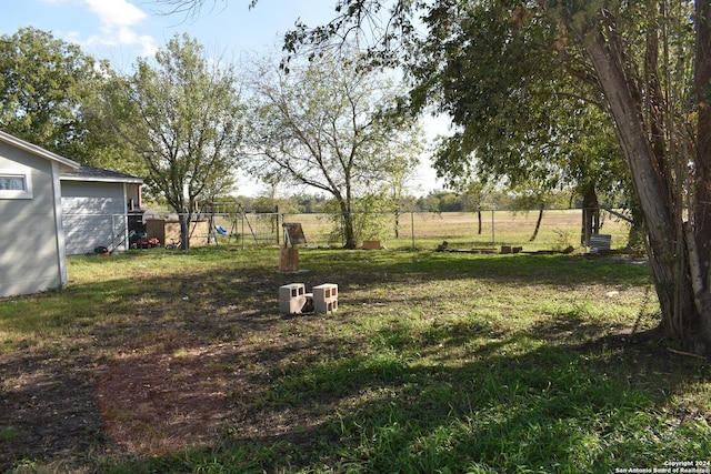 view of yard with a rural view