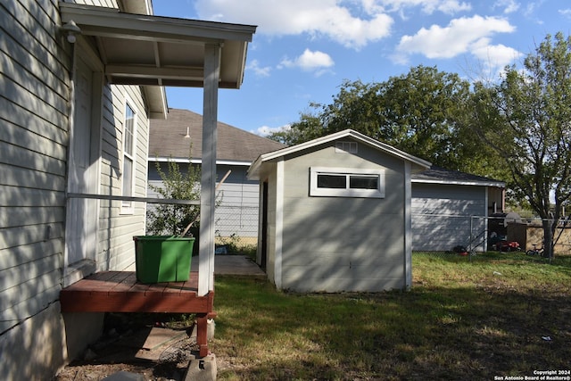 exterior space with a lawn and a shed