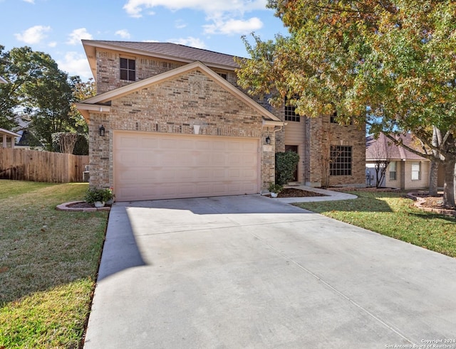 view of front property with a garage and a front lawn