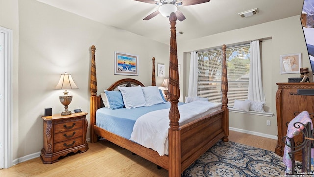 bedroom featuring ceiling fan and light hardwood / wood-style flooring