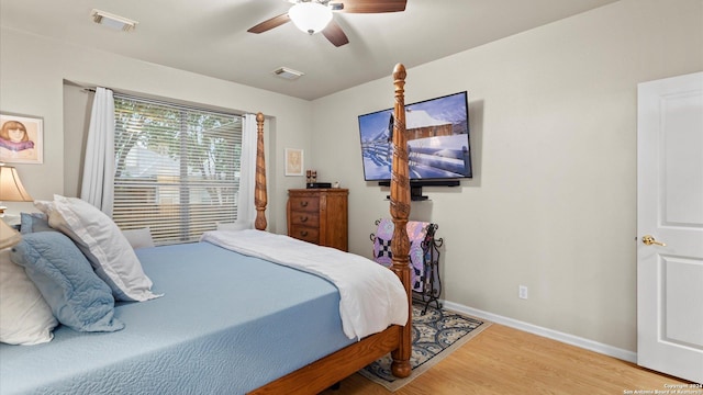 bedroom featuring hardwood / wood-style flooring and ceiling fan