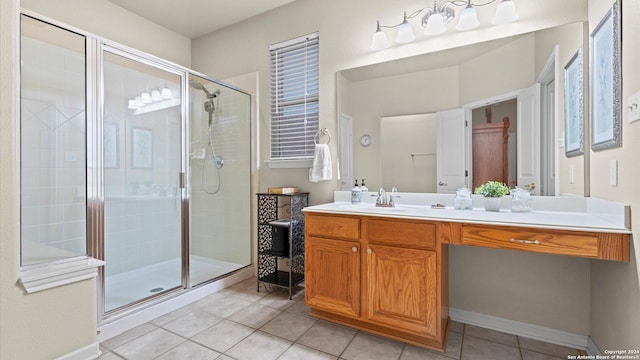 bathroom with vanity, tile patterned floors, and a shower with door