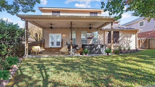 back of house with french doors, a yard, a patio, and ceiling fan