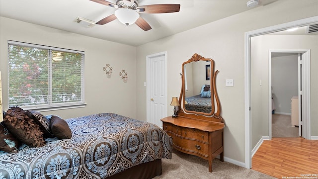 bedroom featuring hardwood / wood-style flooring and ceiling fan