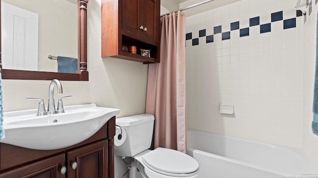 full bathroom with vanity, toilet, and shower / bath combo with shower curtain