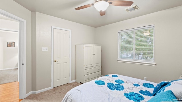 carpeted bedroom featuring ceiling fan