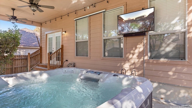 exterior space featuring ceiling fan and a hot tub