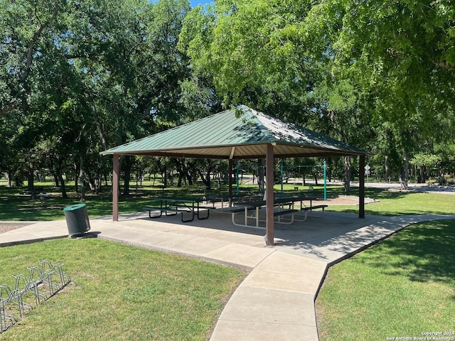 view of property's community with a gazebo and a lawn