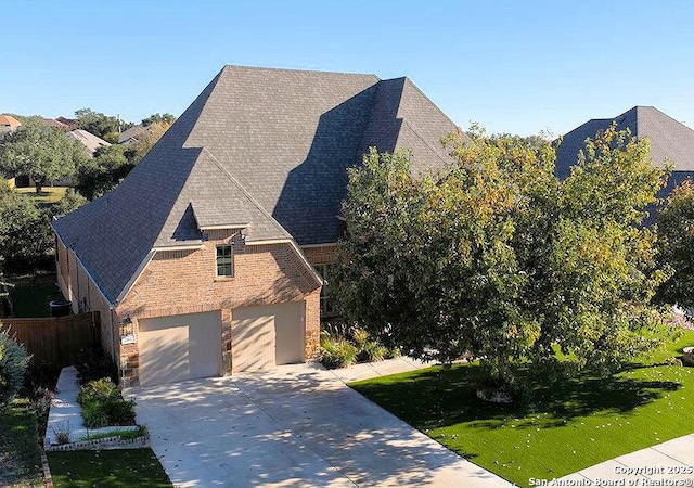 view of property exterior featuring a yard and a garage