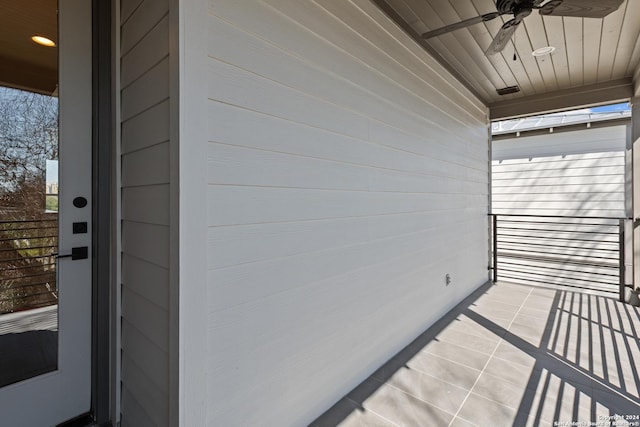 exterior space with ceiling fan