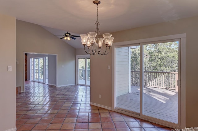 interior space featuring tile patterned floors, plenty of natural light, ceiling fan with notable chandelier, and vaulted ceiling