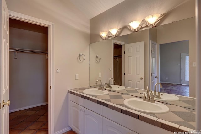 bathroom with tile patterned floors and vanity