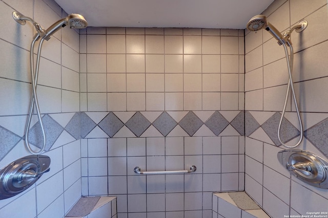 bathroom with tiled shower