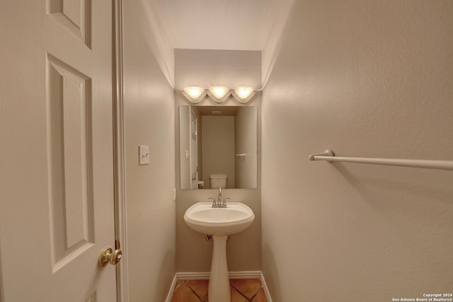 bathroom featuring tile patterned flooring and toilet