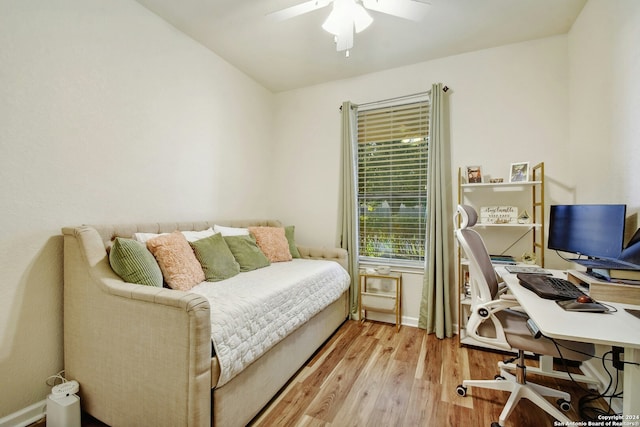 bedroom with ceiling fan and light wood-type flooring