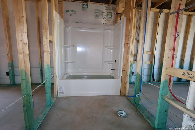 bathroom with concrete flooring