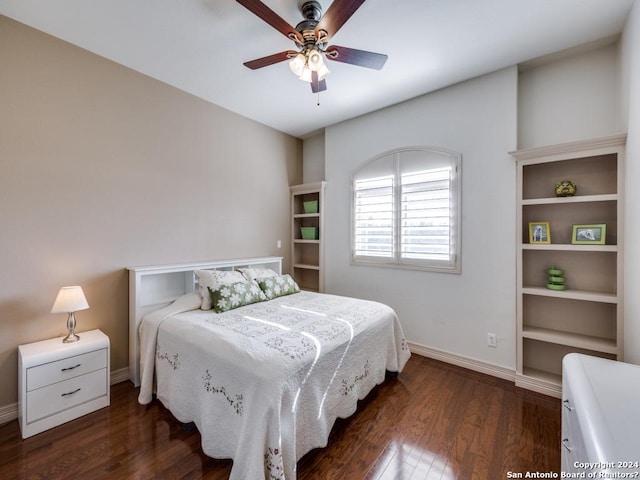 bedroom featuring ceiling fan, baseboards, and dark wood-style flooring