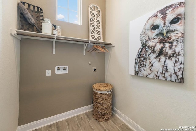 washroom with electric dryer hookup, hookup for a washing machine, and wood-type flooring