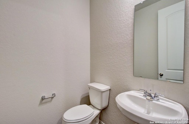 bathroom with sink and toilet