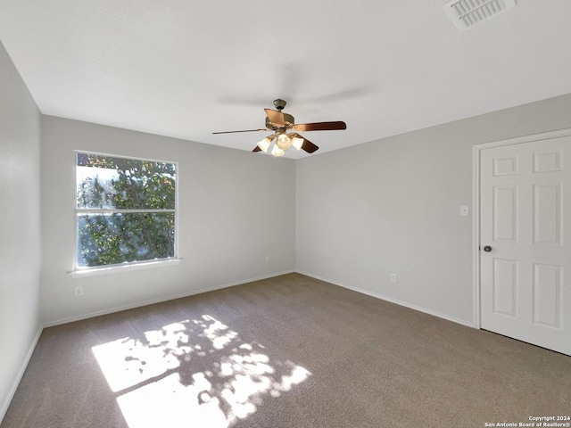 unfurnished room featuring carpet flooring and ceiling fan