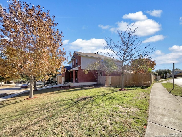 view of property exterior with a yard