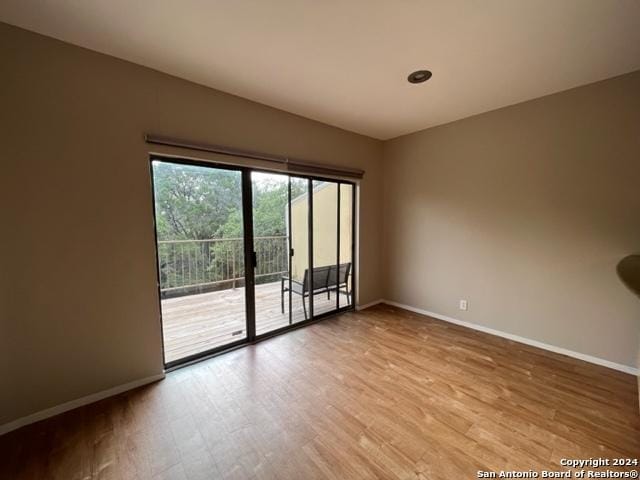 spare room with light wood-type flooring