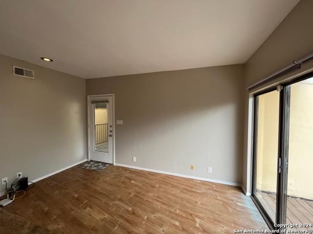 unfurnished room with light hardwood / wood-style flooring