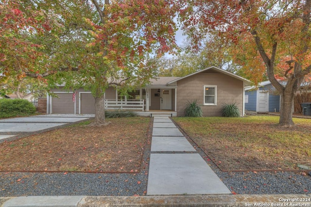 view of front facade with a porch and a garage