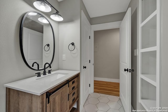 bathroom featuring tile patterned floors and vanity